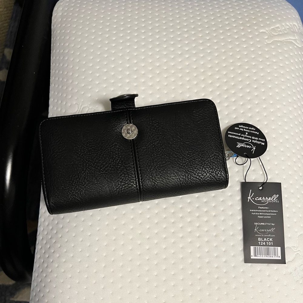 Black wallet with tags
